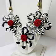 FICKLESTICKS Triple Daisy Necklace - BLACK AND WHITE (RED CENTER)